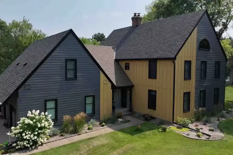 House with yellow and gre siding.